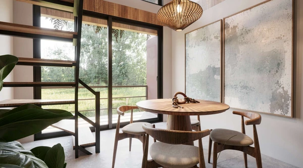 Canto de jantar do Studio Superior com mesa redonda e vista para o jardim